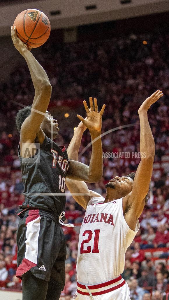 Rich Janzaruk Troy's Zay Willimas shoots over Indiana's Jerome Hunter during an NCAA college basketball game Saturday, Nov. 16, 2019, in Bloomington, Ind. (Rich Janzaruk/The Herald-Times via AP)