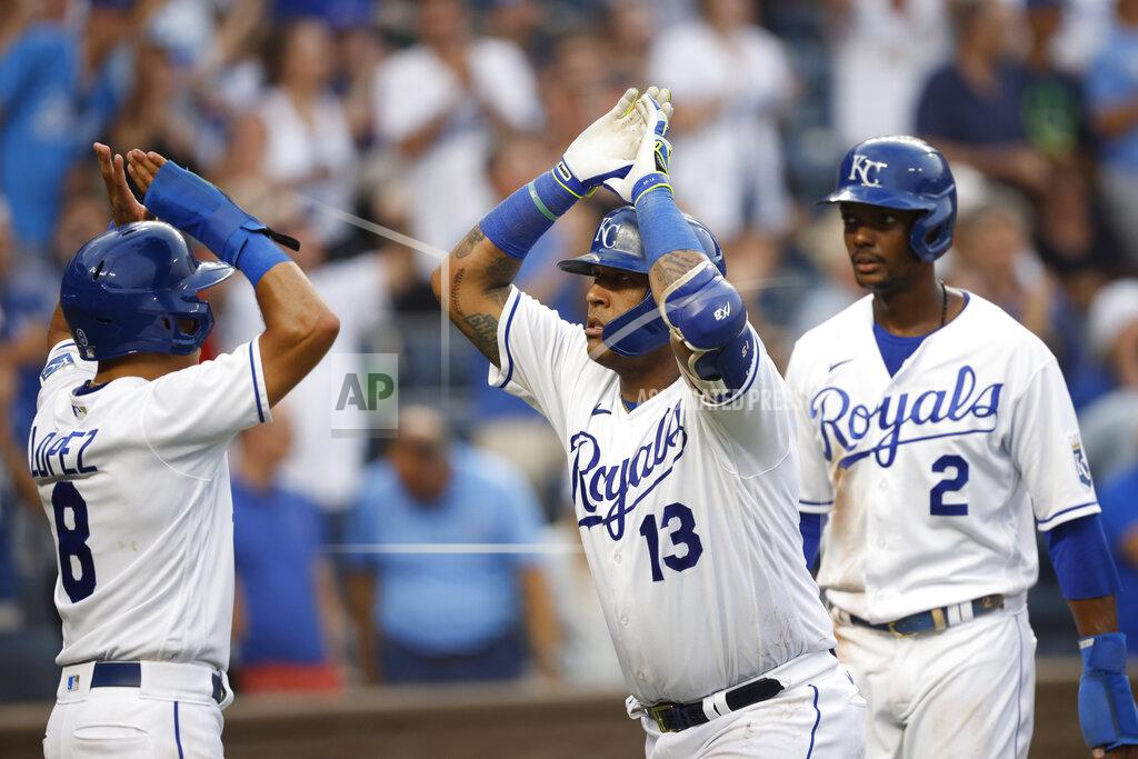 Colin E. Braley Kansas City Royals' Salvador Perez (13) is congratulated by teammates Nicky Lopez (8) and Michael A. Taylor (2) after hitting a three-run home run during the fifth inning of a baseball game against the Detroit Tigers at Kauffman Stadium in Kansas City, Mo., Saturday, July 24, 2021. (AP Photo/Colin E. Braley)
