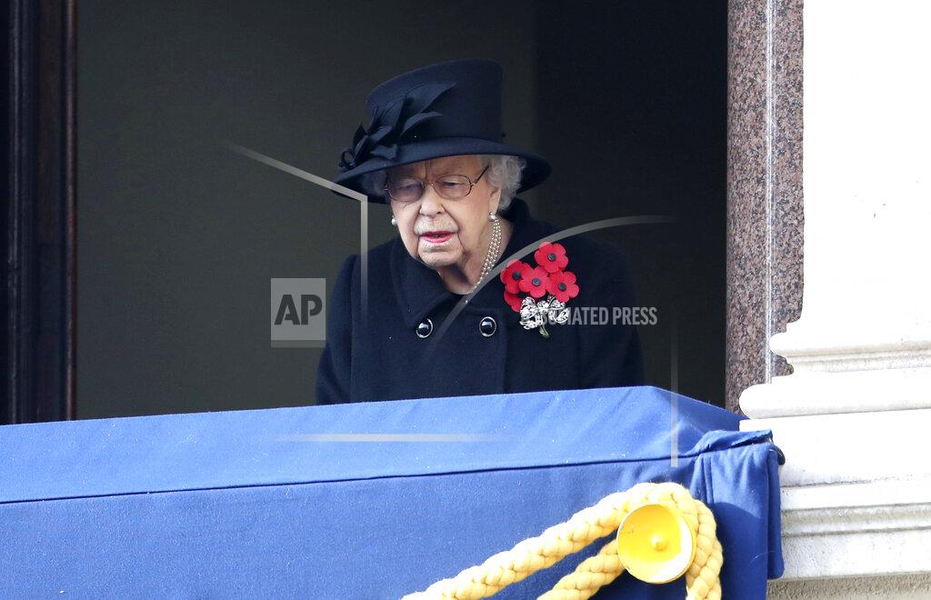 Chris Jackson Britain's Queen Elizabeth II stands on the balcony of the Foreign Office, during the Remembrance Sunday service at the Cenotaph, in Whitehall, London, Sunday Nov. 8, 2020. (Chris Jackson/Pool Photo via AP)