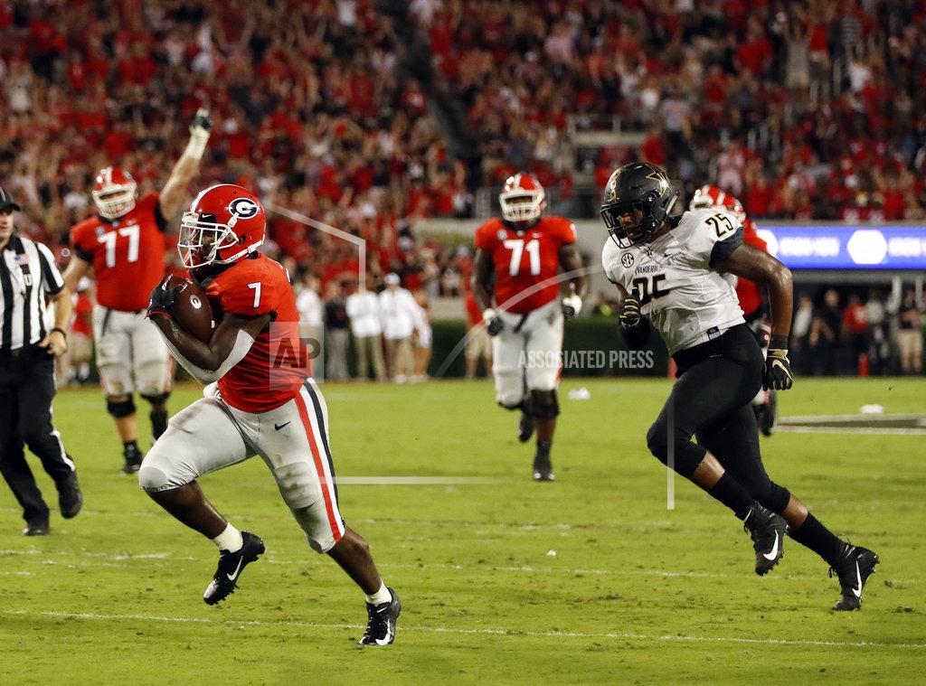 John Bazemore Georgia running back D'Andre Swift (7) out runs Vanderbilt linebacker Josh Smith (25) on his way to a touchdown after catching a pass during the second half of an NCAA college football game Saturday, Oct. 6, 2018, in Atlanta. (AP Photo/John Bazemore)