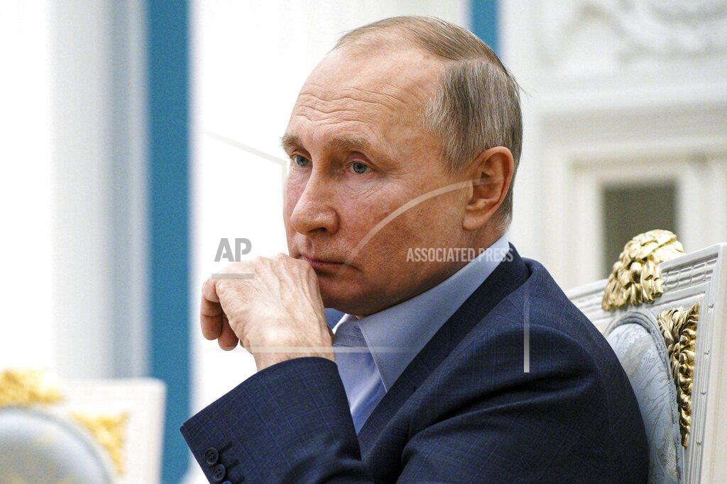 Alexei Druzhinin FILE - In this Thursday, March 4, 2021 file photo, Russian President Vladimir Putin listens during a meeting with participants of the We Are Together nationwide volunteer campaign in the Kremlin in Moscow, Russia. Hit by a barrage of new sanctions from the Biden administration, the Kremlin is carefully weighing its response in a tense showdown with the United States.(Alexei Druzhinin, Sputnik, Kremlin Pool Photo via AP, File)