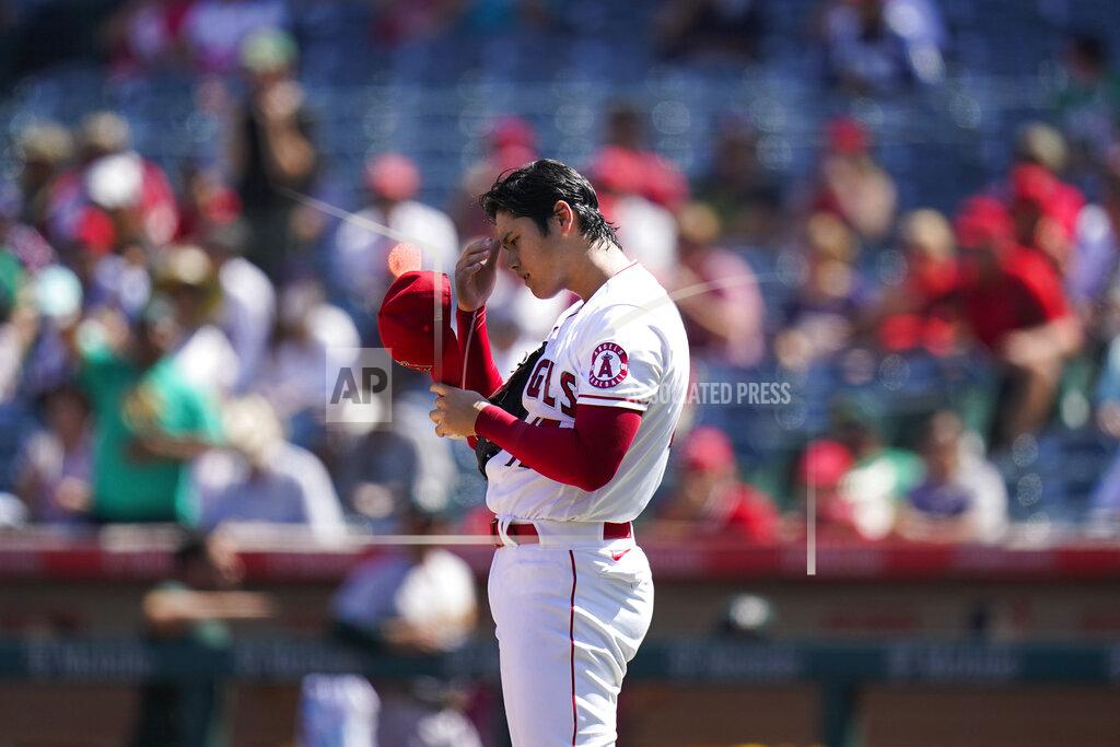 Jae C. Hong Los Angeles Angels starting pitcher Shohei Ohtani, of Japan, adjusts his hat after giving up a home run against Oakland Athletics' Yan Gomes, not pictured, during the third inning of a baseball game Sunday, Sept. 19, 2021, in Anaheim, Calif. (AP Photo/Jae C. Hong)