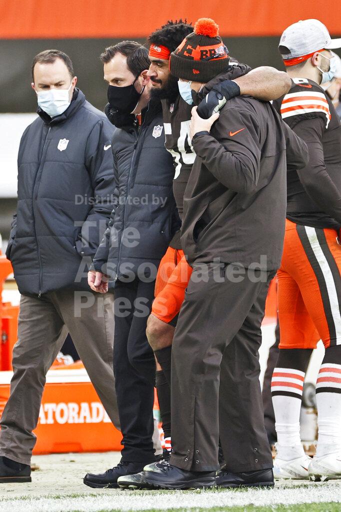 Cleveland Browns defensive end Olivier Vernon is helped off the field after an injury during the second half of an NFL football game against the Pittsburgh Steelers, Sunday, Jan. 3, 2021, in Cleveland. (AP Photo/Ron Schwane, File)