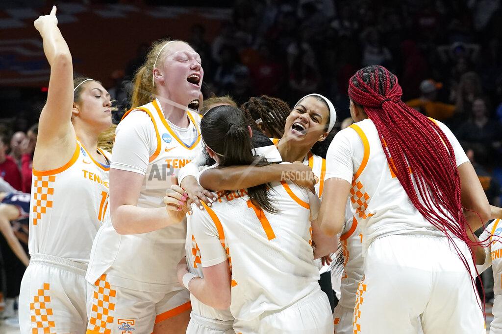 Mark Humphrey Tennessee players celebrate after beating Belmont in a women's college basketball game in the second round of the NCAA tournament Monday, March 21, 2022, in Knoxville, Tenn. (AP Photo/Mark Humphrey)
