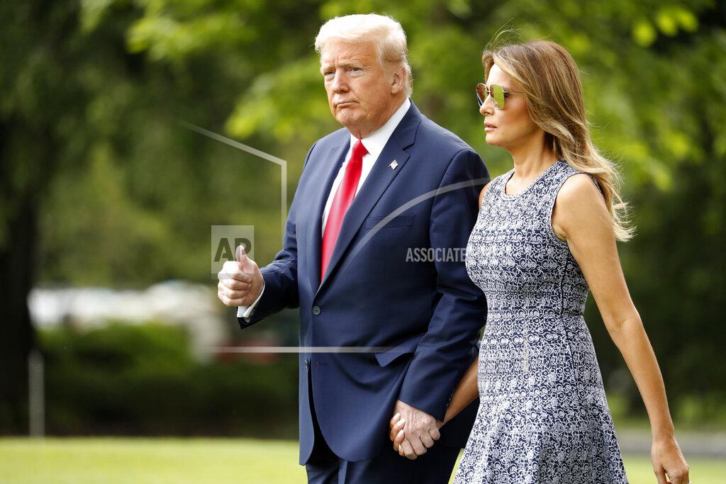 Andrew Harnik President Donald Trump and first lady Melania Trump walk on the South Lawn of the White House in Washington, Wednesday, May 27, 2020, before boarding Marine One for a short trip to Andrews Air Force Base, Md. Trump is traveling to Kennedy Space Center, Fla., for the launch of a rocket ship built by the SpaceX company, putting NASA back in the business of launching astronauts from U.S. soil for the first time in nearly a decade. (AP Photo/Andrew Harnik)