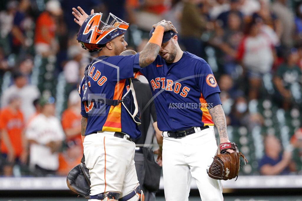 Michael Wyke Houston Astros catcher Martin Maldonado, left, and closing pitcher Ryan Pressly, right, pat each other on the head after their 3-1 win over the Los Angeles Angels after a baseball game Sunday, Sept. 12, 2021, in Houston. (AP Photo/Michael Wyke)