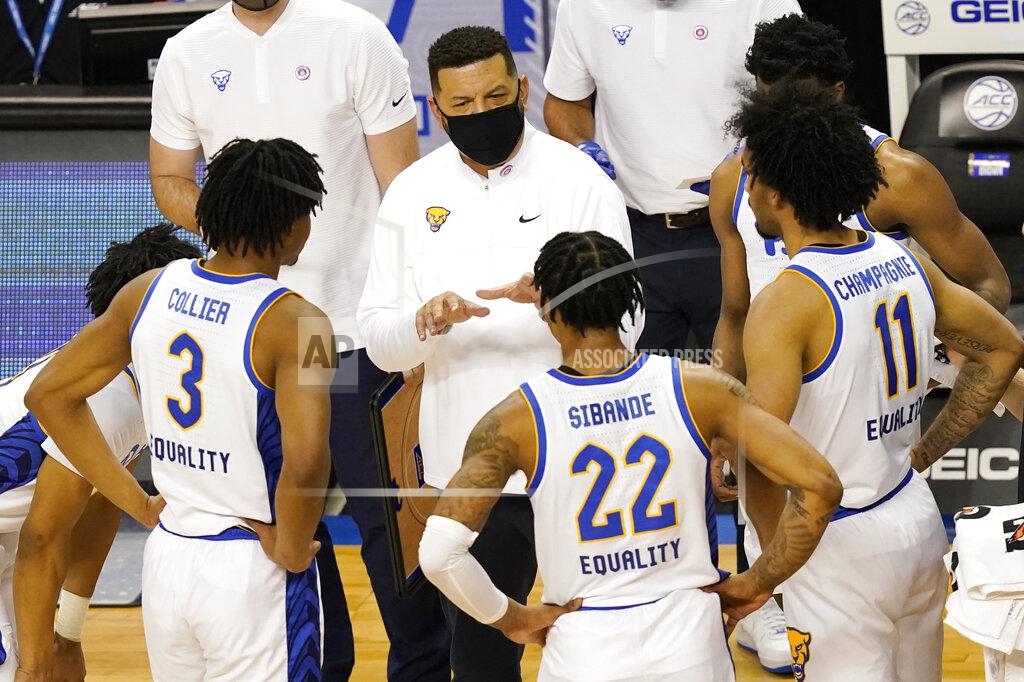 Gerry Broome Pittsburgh head coach Jeff Capel III, top, talks with his team during the first half an NCAA college basketball game in the first round of the Atlantic Coast Conference tournament in Greensboro, N.C., Tuesday, March 9, 2021. (AP Photo/Gerry Broome)
