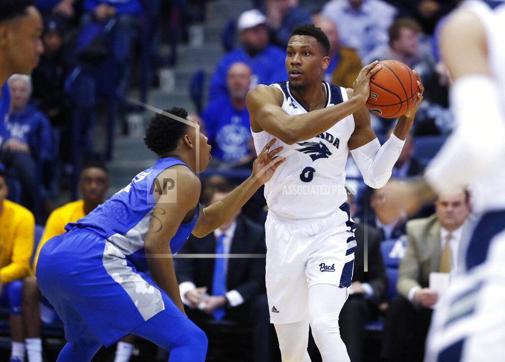 David Zalubowski Nevada forward Tre'Shawn Thurman, right, looks to pass the ball as Air Force forward Lavelle Scottie defends during the first half of an NCAA college basketball game Tuesday, March 5, 2019, at Air Force Academy, Colo. (AP Photo/David Zalubowski)