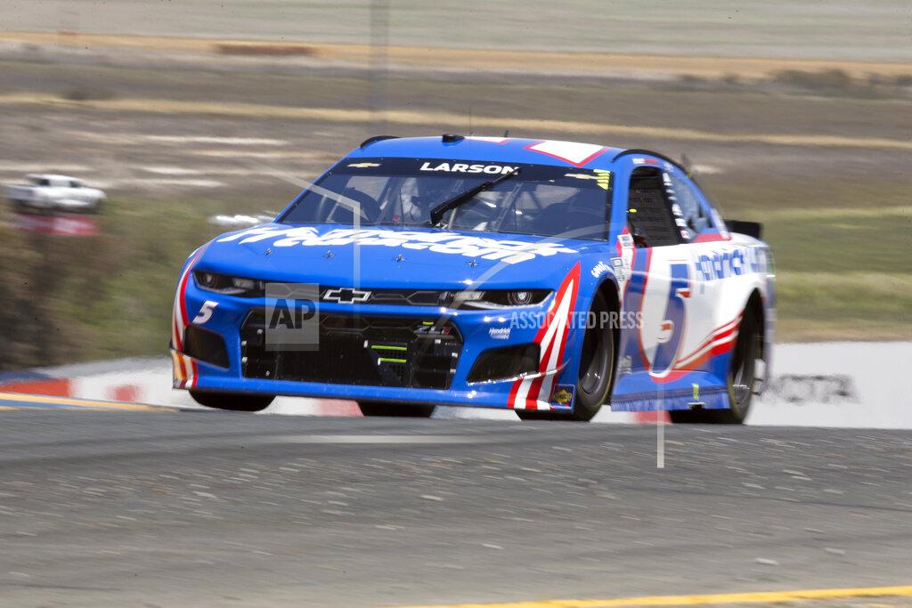 D. Ross Cameron Kyle Larson speeds through turn 2 during a NASCAR Cup Series race, Sunday, June 6, 2021, at Sonoma Raceway in Sonoma, Calif. Larson won the first and second stages of the 350-mile race. (AP Photo/D. Ross Cameron)