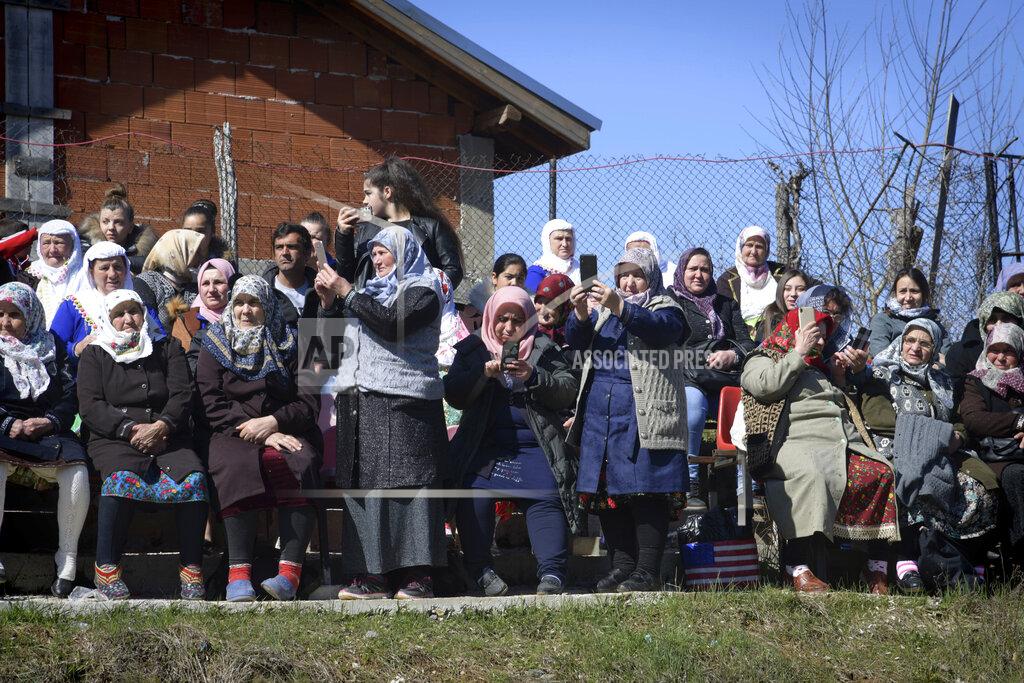 Jordan Simeonov Bulgarian muslims use their mobile phones to make photos during mass circumcision ceremony in the village of Ribnovo, Bulgaria, Sunday, April 11, 2021. Despite the dangers associated with COVID-19 and government calls to avoid large gatherings, Hundreds of people flocked to the tiny village of Ribnovo in southwestern Bulgaria for a four-day festival of feasting, music and the ritual of circumcision which is considered by Muslims a religious duty and essential part of a man's identity. (AP Photo/Jordan Simeonov)