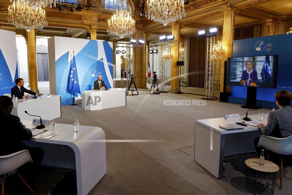 Ludovic Marin French President Emmanuel Macron, second left, European Council President Charles Michel, center, Senegal's President Macky Sall, left, and International Monetary Fund Managing Director Kristalina Georgieva listen to listen to European Commission President Ursula von der Leyen, on a screen, during The Paris Peace Forum at The Elysee Palace in Paris, Thursday, Nov. 12, 2020. (Ludovic Marin, Pool via AP)