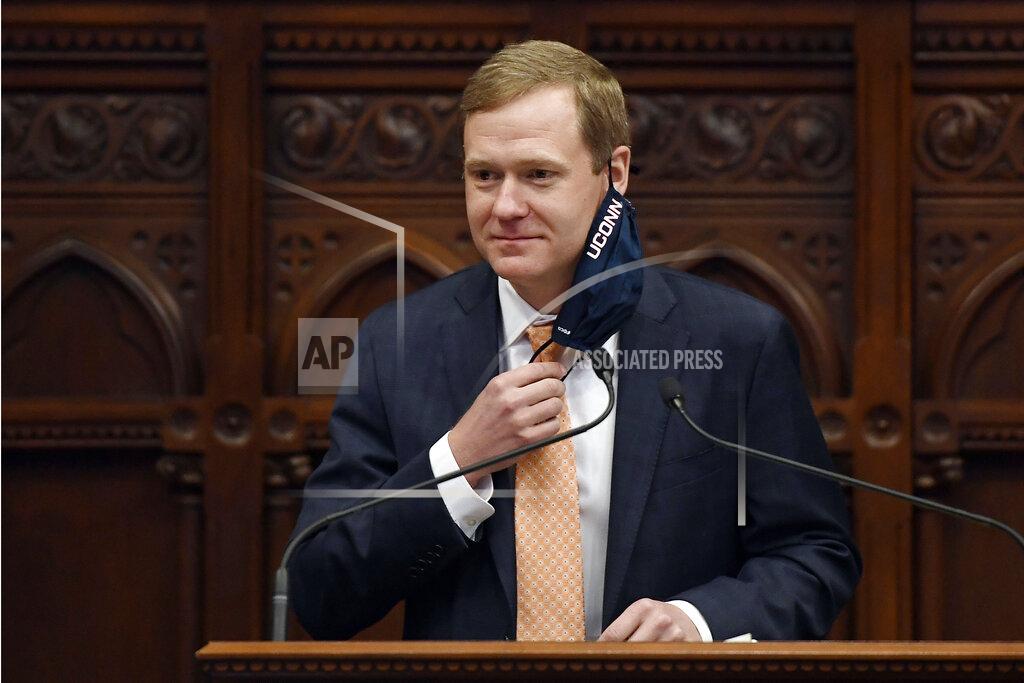 Jessica Hill Connecticut Speaker of the House Matt Ritter, D-Hartford, pulls up his mask during session at the State Capitol, Monday, April 19, 2021. The Connecticut House of Representatives on Monday was expected to pass a contentious bill that would end the state's long-standing religious exemption from immunization requirements for schools. (AP Photo/Jessica Hill)
