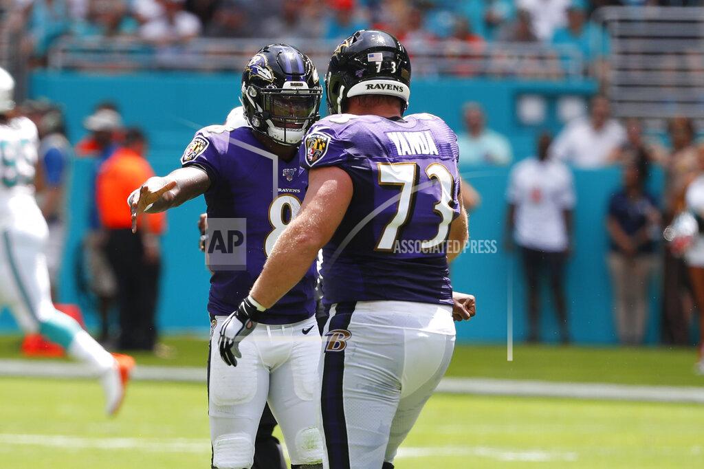 Wilfredo Lee Baltimore Ravens quarterback Lamar Jackson (8) celebrates a touchdown with offensive guard Marshal Yanda (73), during the first half at an NFL football game against the Miami Dolphins, Sunday, Sept. 8, 2019, in Miami Gardens, Fla. (AP Photo/Wilfredo Lee)