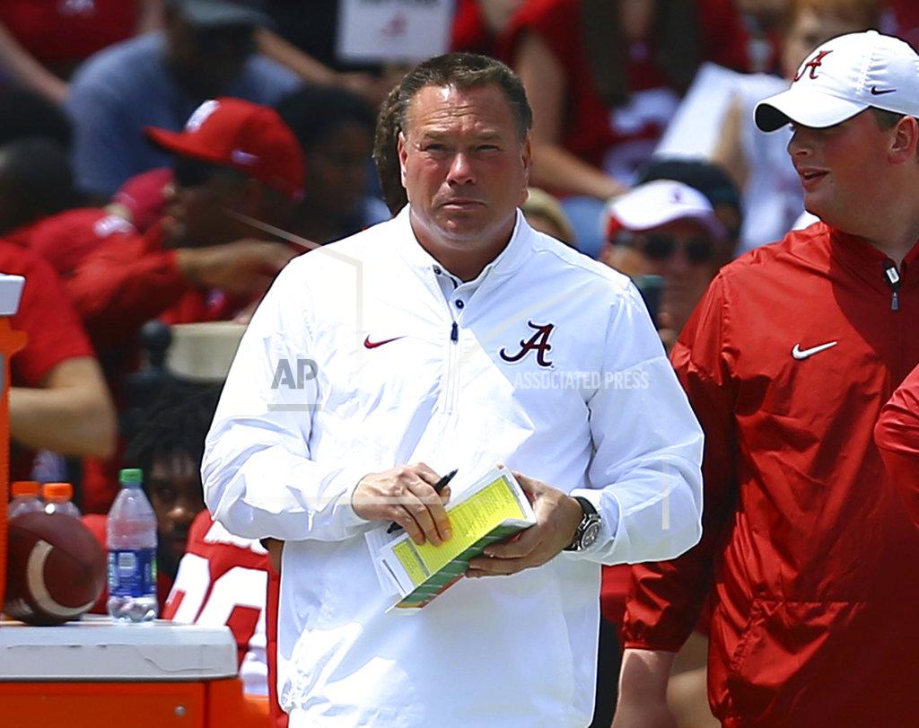Butch Dill FILE - In this April 21, 2018, file photo, former Tennessee coach Butch Jones, now an analyst for Alabama, watches from the sidelines during the first half of the Crimson Tide's spring NCAA college football game in Tuscaloosa, Ala. The top-ranked Crimson Tide face Tennessee on Saturday.(AP Photo/Butch Dill, File)