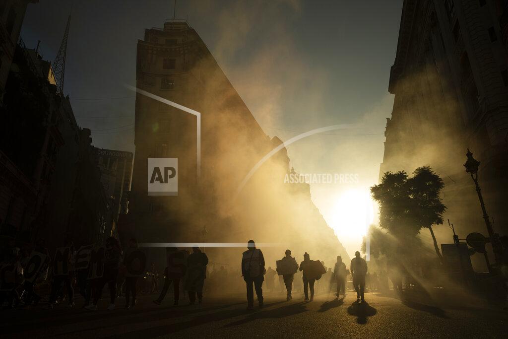 Victor R. Caivano Protesters arrive at the Plaza de Mayo to demand higher salaries and more jobs, in Buenos Aires, Argentina, Thursday, May 12, 2022. (AP Photo/Victor R. Caivano)