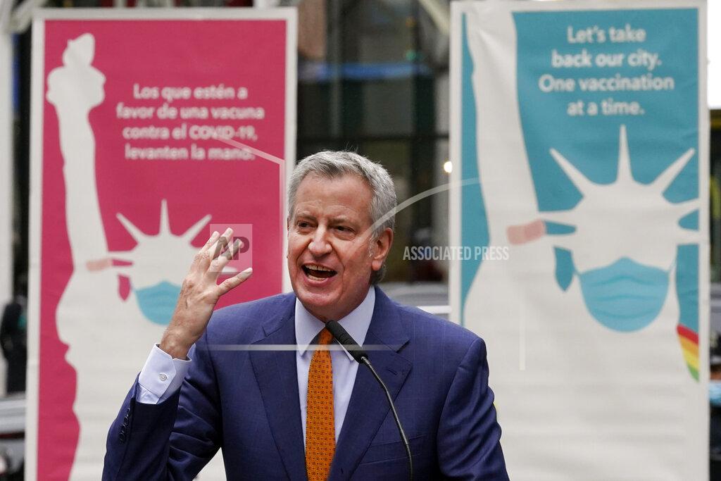 Richard Drew New York Mayor Bill de Blasio delivers his remarks in Times Square after he toured the grand opening of a Broadway COVID-19 vaccination site intended to jump-start the city's entertainment industry, in New York, Monday, April 12, 2021. (AP Photo/Richard Drew)