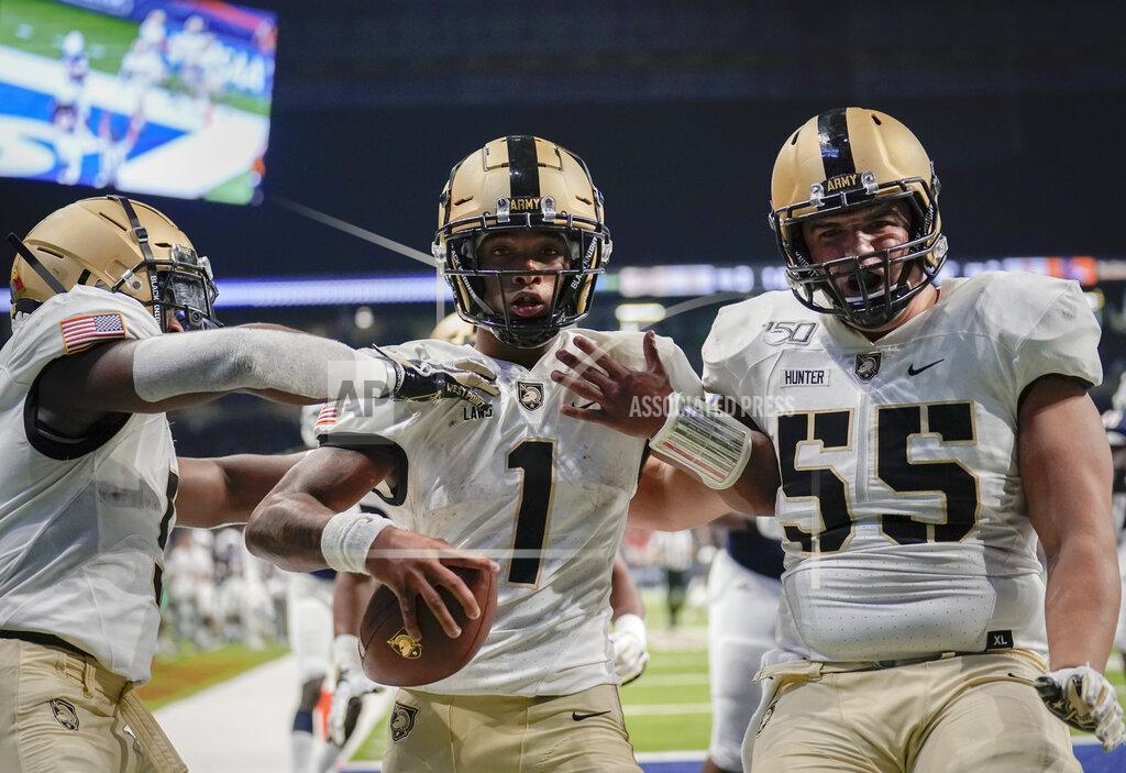 Darren Abate Army quarterback Jabari Laws (1) celebrates with teammates J.B. Hunter (55) and Kell Walker after running for a touchdown during the second half of an NCAA college football game against UTSA on Saturday, Sept. 14, 2019 in San Antonio. (AP Photo/Darren Abate)