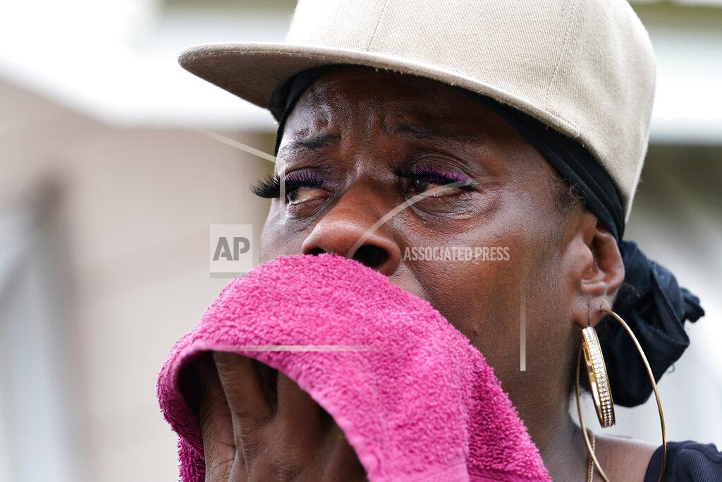 Gerald Herbert Rakisha Murray cries in relief as she arrives to see her mother's home largely undamaged, after she returned from evacuation with her mother and other family in Lake Charles, La., in the aftermath of Hurricane Laura, Sunday, Aug. 30, 2020. (AP Photo/Gerald Herbert)