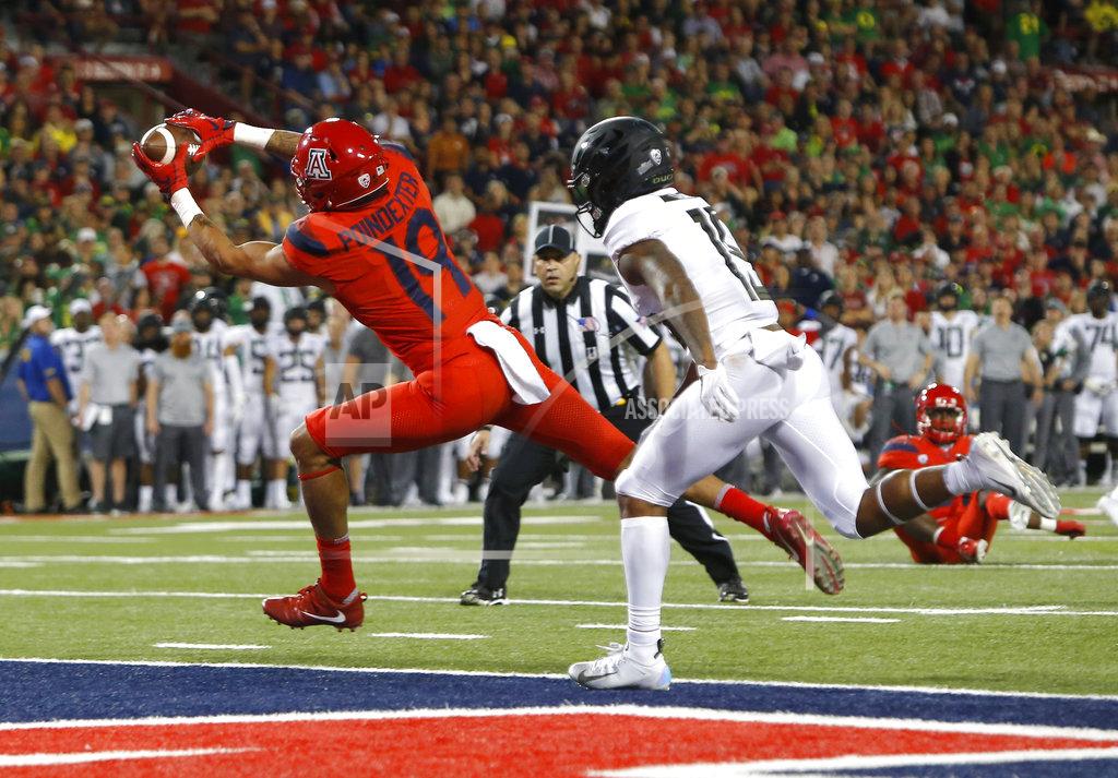 Rick Scuteri Arizona wide receiver Shawn Poindexter (19) makes the catch for a touchdown in front of Oregon cornerback Deommodore Lenoir in the second half during an NCAA college football game, Saturday, Oct. 27, 2018, in Tucson, Ariz. (AP Photo/Rick Scuteri)