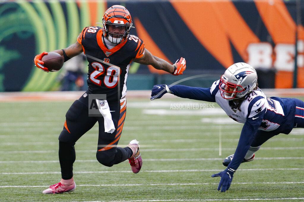 Frank Victores Cincinnati Bengals running back Joe Mixon (28) breaks a tackle by New England Patriots cornerback Stephon Gilmore (24) in the second half of an NFL football game, Sunday, Dec. 15, 2019, in Cincinnati. (AP Photo/Frank Victores)