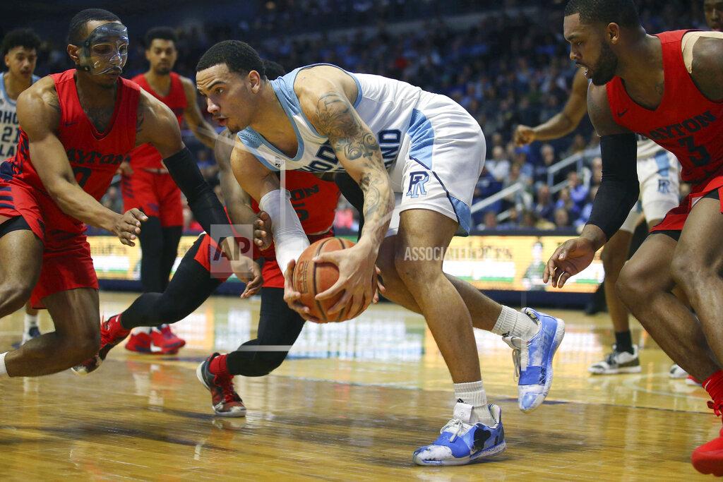 Stew Milne Rhode Island's Tyrese Martin (4) grabs a loose ball ahead of Dayton's Rodney Chatman (0) during the second half of an NCAA college basketball game Wednesday, March 4, 2020, in Kingston, R.I. (AP Photo/Stew Milne)
