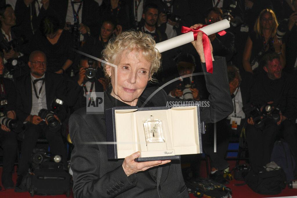 Petros Giannakouris Claire Denis, winner of the grand prize for 'Stars at Noon,' poses for photographers during the photo call following the awards ceremony at the 75th international film festival, Cannes, southern France, Saturday, May 28, 2022. (AP Photo/Petros Giannakouris)