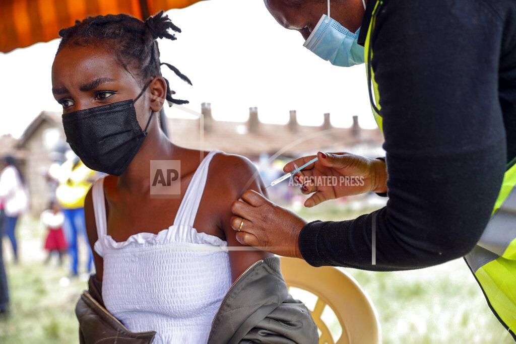 Brian Inganga A Kenyan woman receives a dose of AstraZeneca coronavirus vaccine donated by Britain, at the Makongeni Estate in Nairobi, Kenya Saturday, Aug. 14, 2021. In late June, the international system for sharing coronavirus vaccines sent about 530,000 doses to Britain – more than double the amount sent that month to the entire continent of Africa. It was the latest example of how a system that was supposed to guarantee low and middle-income countries vaccines is failing, leaving them at the mercy of haphazard donations from rich countries. (AP Photo/Brian Inganga)