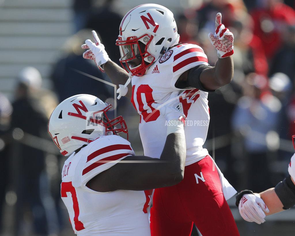 Jim Young Nebraska's JD Spielman, right, celebrates with teammate Jerald Foster after scoring a touchdown against Northwestern during the first half of an NCAA college football game Saturday, Oct. 13, 2018, in Evanston, Ill.. (AP Photo/Jim Young)