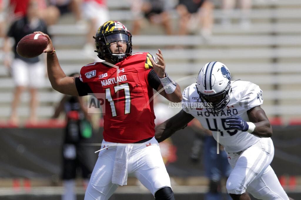 Julio Cortez Maryland quarterback Josh Jackson (17) looks to pass as Howard defensive lineman Elton Jean-Baptiste (45) moves in to make a hit on him during the first half of an NCAA college football game, Saturday, Aug. 31, 2019, in College Park, Md. (AP Photo/Julio Cortez)