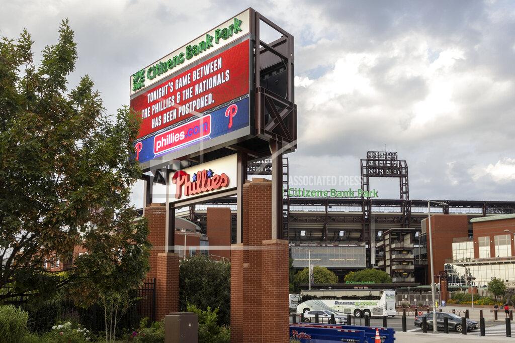Laurence Kesterson A sign outside the stadium advises that the baseball game between the Philadelphia Phillies and the Washington Nationals has been postponed, Wednesday, July 28, 2021, in Philadelphia. The postponement was due to COVID-19 issues among the Nationals. (AP Photo/Laurence Kesterson)
