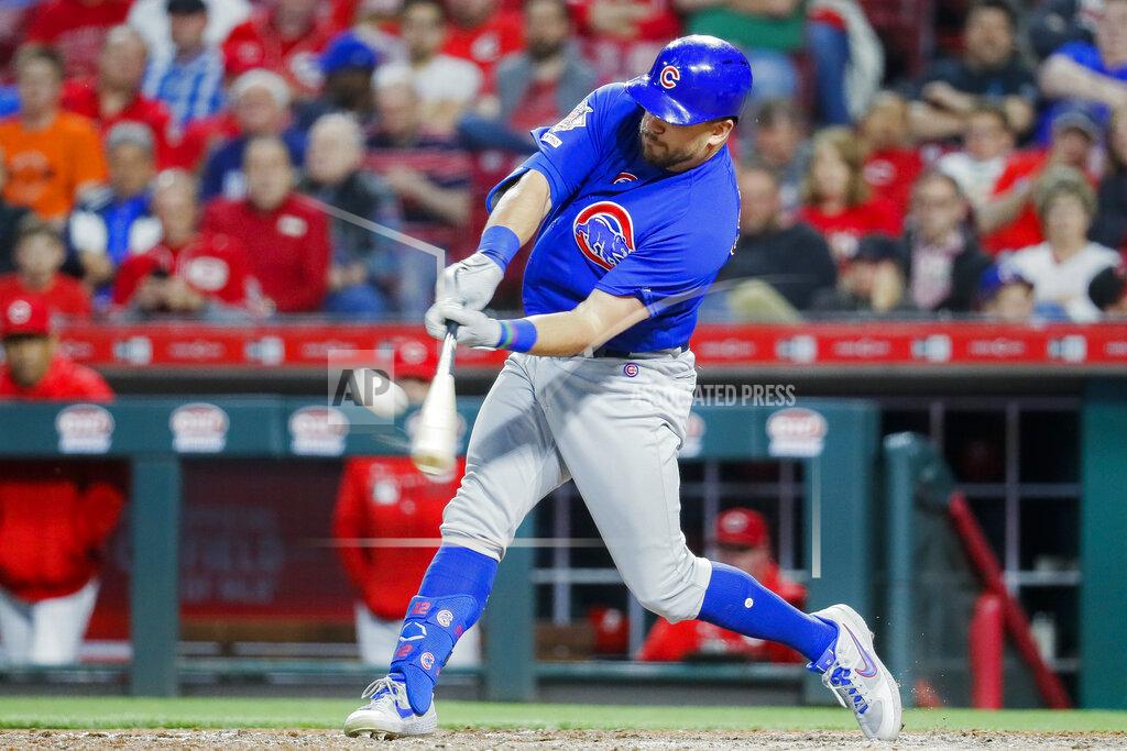 John Minchillo FILE - In this May 15, 2019, file photo, Chicago Cubs' Kyle Schwarber hits a solo home run off Cincinnati Reds relief pitcher David Hernandez in the eighth inning of a baseball game in Cincinnati. Schwarber agreed in principle to a one-year, $10 million contract with the Washington Nationals, according to a person familiar with the deal. The person confirmed the agreement to The Associated Press on condition of anonymity on Saturday, Jan. 9, 2021, because a physical exam was still pending for Schwarber. (AP Photo/John Minchillo, File)