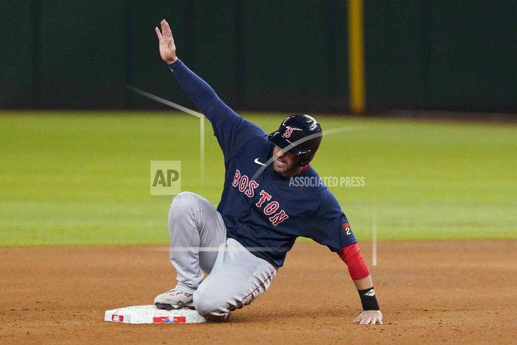 Lm Otero Boston Red Sox's J.D. Martinez reaches second base on a single by Xander Bogaerts during the sixth inning of the team's baseball game against the Texas Rangers in Arlington, Texas, Friday, May 13, 2022. The Red Sox won 7-1. (AP Photo/LM Otero)