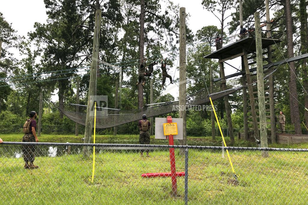 Lolita Baldor Female Marines go through one of the obstacles in the so-called confidence course designed to make them face their fears and gain confidence at Parris Island on May 27, 2020. In ways big and small, the virus is impacting training at the Marine Corps' Parris Island Recruit Depot and across the military. (AP Photo/Lolita Baldor)