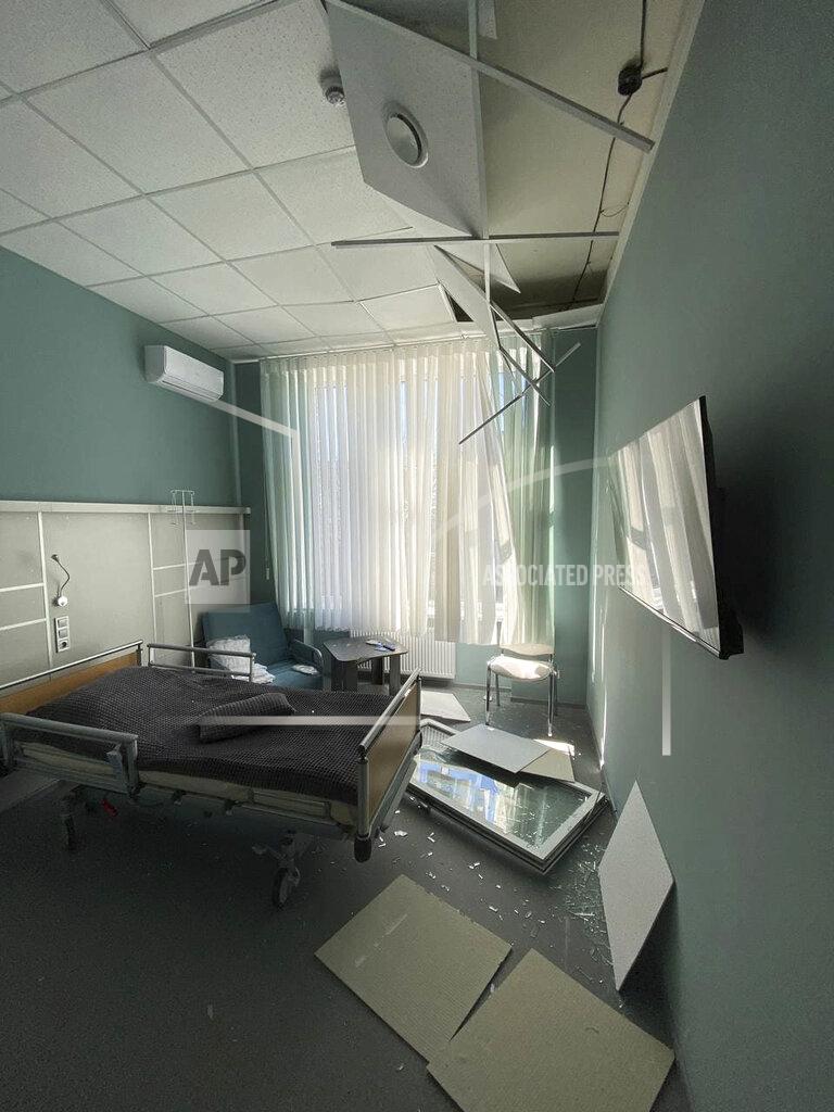 Yulia Ablamskaya This photo provided by Yulia Ablamskaya shows the aftermath of shelling at the MediLand Medical Center in Kyiv, Ukraine, on March 16, 2022. Ablamskaya was one of 17 employees inside the facility when she says a loud “boom” rocked the building in the early morning hours of March 16. As the chaos unfolded, she hurried to get the three remaining patients at the center to a safer place. The patients, she said, are all awaiting operations and unable to travel. “We felt the walls of the building shivering,” Ablamskaya, an administrator at the clinic, recounted. “So, we of course jumped up and went to take the patients.” (Yulia Ablamskaya via AP)