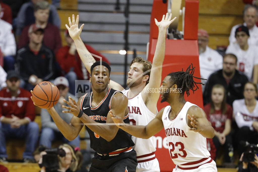 Darron Cummings Princeton's Richmond Aririguzoh (34) prepares to pass the ball as Indiana's Joey Brunk (50) and Damezi Anderson (23) defend during the first half of an NCAA college basketball game Wednesday, Nov. 20, 2019, in Bloomington, Ind. (AP Photo/Darron Cummings)