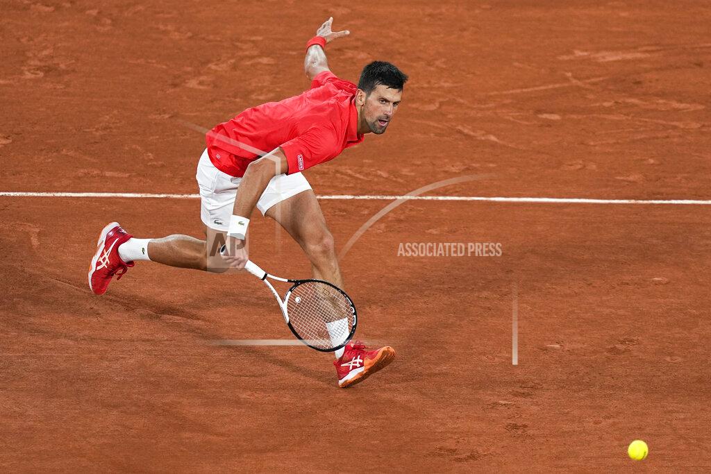Michel Euler Serbia's Novak Djokovic plays a shot against Japan's Yoshihito Nishioka during their first round match at the French Open tennis tournament in Roland Garros stadium in Paris, France, Monday, May 23, 2022. (AP Photo/Michel Euler)