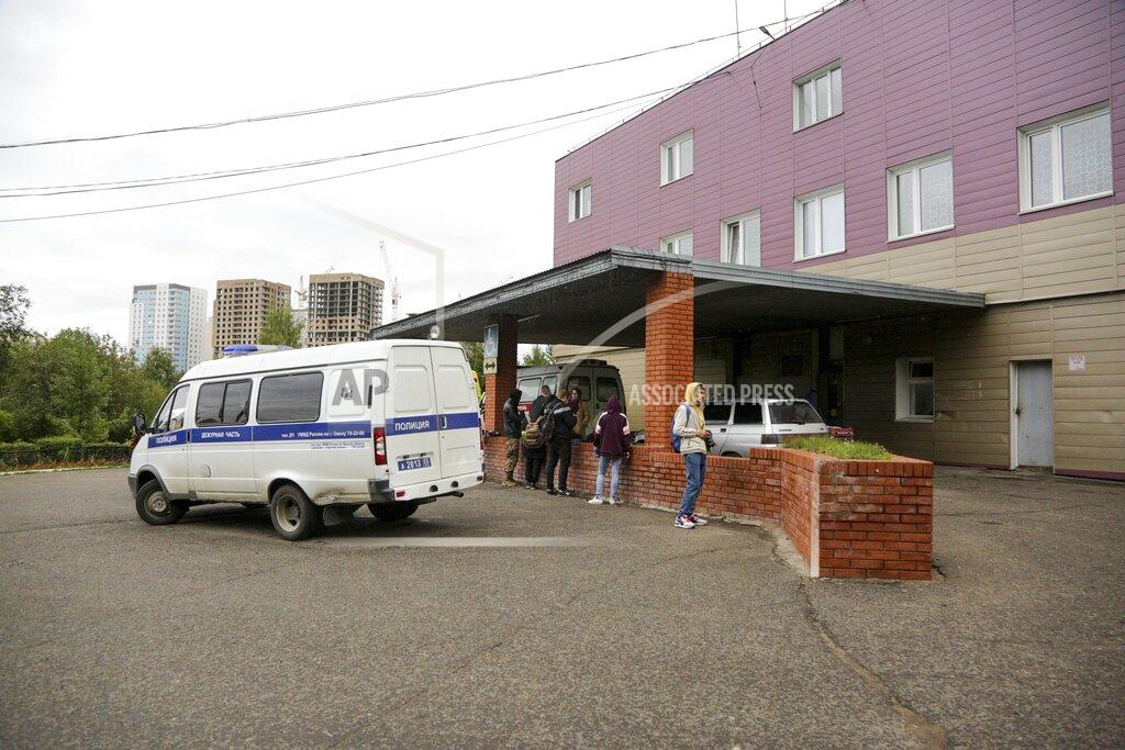 Evgeniy Sofiychuk An ambulance is parked outside the hospital intensive care unit where Alexei Navalny is hospitalized in Omsk, Russia, Thursday, Aug. 20, 2020. Russian opposition politician Alexei Navalny is on a hospital ventilator in a coma, after falling ill from a suspected poisoning, according to his spokeswoman Kira Yarmysh. (AP Photo/Evgeniy Sofiychuk)