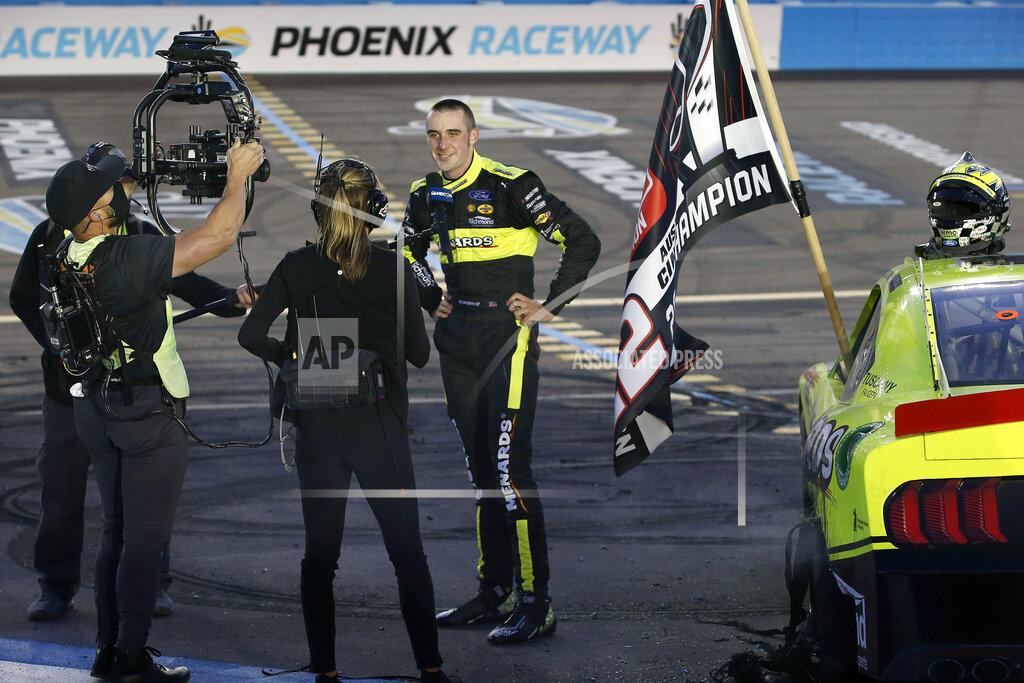 Ralph Freso Austin Cindric, center, gives an interview after winning the NASCAR Xfinity Series auto race at Phoenix Raceway, Saturday, Nov. 7, 2020, in Avondale, Ariz. (AP Photo/Ralph Freso)