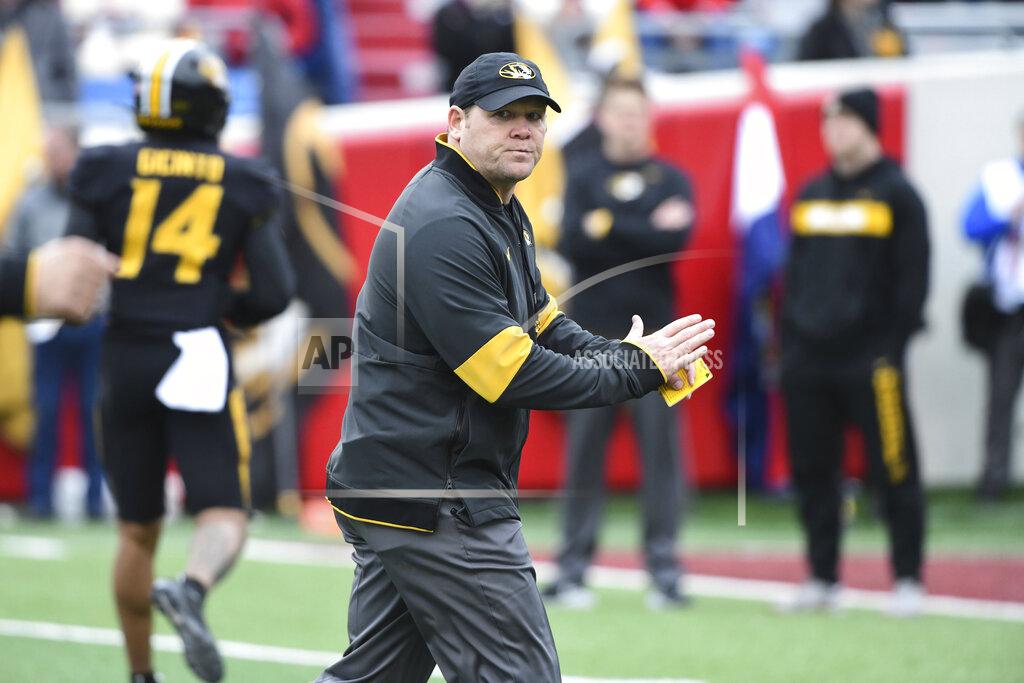 Michael Woods In this Friday, Nov. 29, 2019 photo Missouri coach Barry Odom watches his team during an NCAA college football game against Arkansas in Little Rock, Ark. Missouri fired Odom on Saturday, Nov. 30, 2019, ending the four-year stay of a respected former player who took over a program in disarray but could never get the Tigers over the hump in the brutal SEC. (AP Photo/Michael Woods)