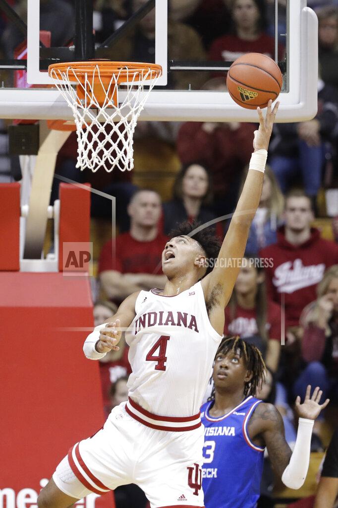 Darron Cummings Indiana's Trayce Jackson-Davis (4) puts up a shot against Louisiana Tech's Amorie Archibald (3) during the second half of an NCAA college basketball game, Monday, Nov. 25, 2019, in Bloomington, Ind. Indiana won 88-75. (AP Photo/Darron Cummings)