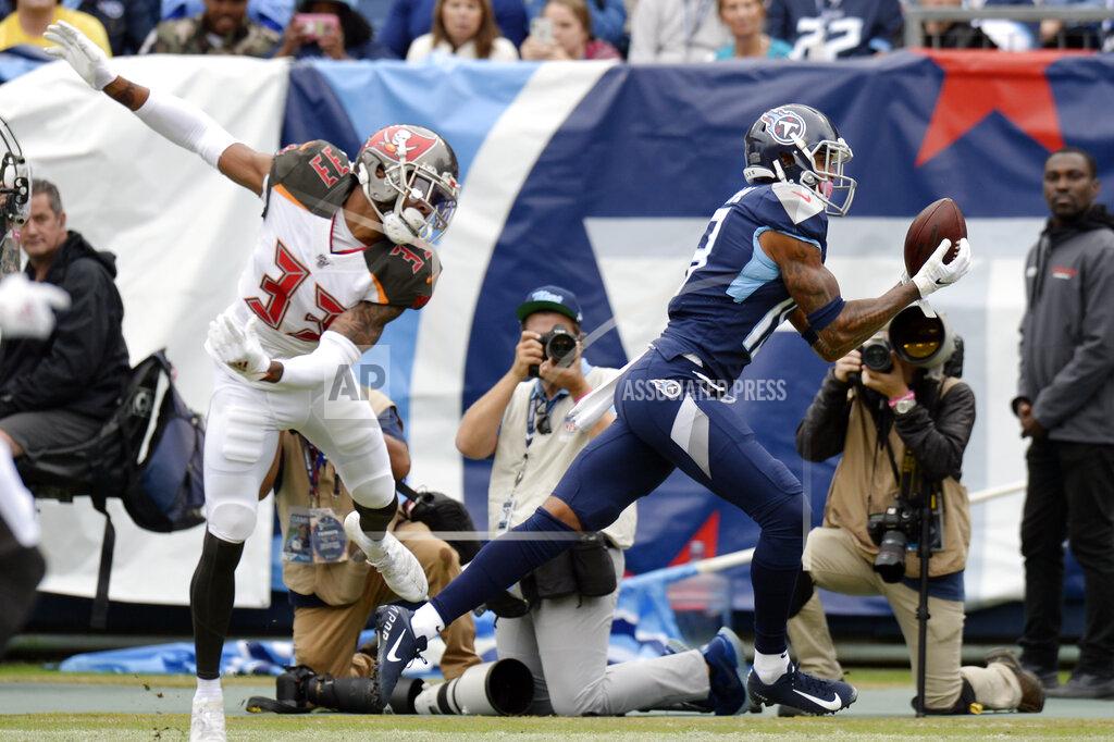 Mark Zaleski Tennessee Titans wide receiver Tajae Sharpe (19) catches a touchdown pass ahead of Tampa Bay Buccaneers cornerback Carlton Davis (33) in the first half of an NFL football game Sunday, Oct. 27, 2019, in Nashville, Tenn. (AP Photo/Mark Zaleski)
