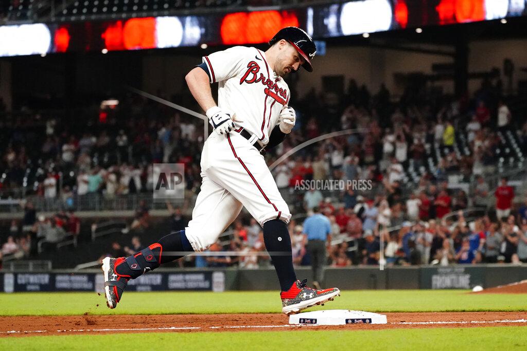 John Bazemore Atlanta Braves' Adam Duvall (14) rounds third base after hitting a two-run home run in the eighth inning of a baseball game against the Colorado Rockies Tuesday, Sept. 14, 2021, in Atlanta. (AP Photo/John Bazemore)