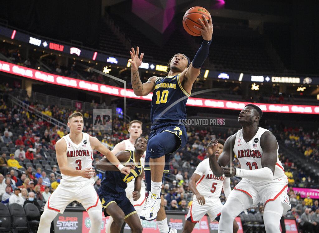 Sam Morris Michigan guard Frankie Collins (10) drives to the basket against the Arizona during an NCAA college basketball game Sunday, Nov. 21, 2021, in Las Vegas. (AP Photo/Sam Morris)