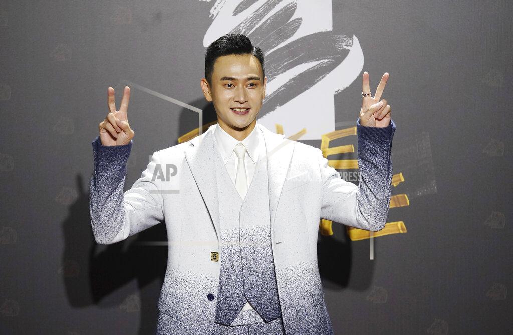 Billy Dai Taiwanese actor Liu Kuan-ting arrives at the 57th Golden Horse Awards in Taipei, Taiwan, Saturday, Nov. 21, 2020. Liu is nominated for Best Leadting Actor for the film "My Missing Valentine" at this year's Golden Horse Awards. (AP Photo/ Billy Dai)