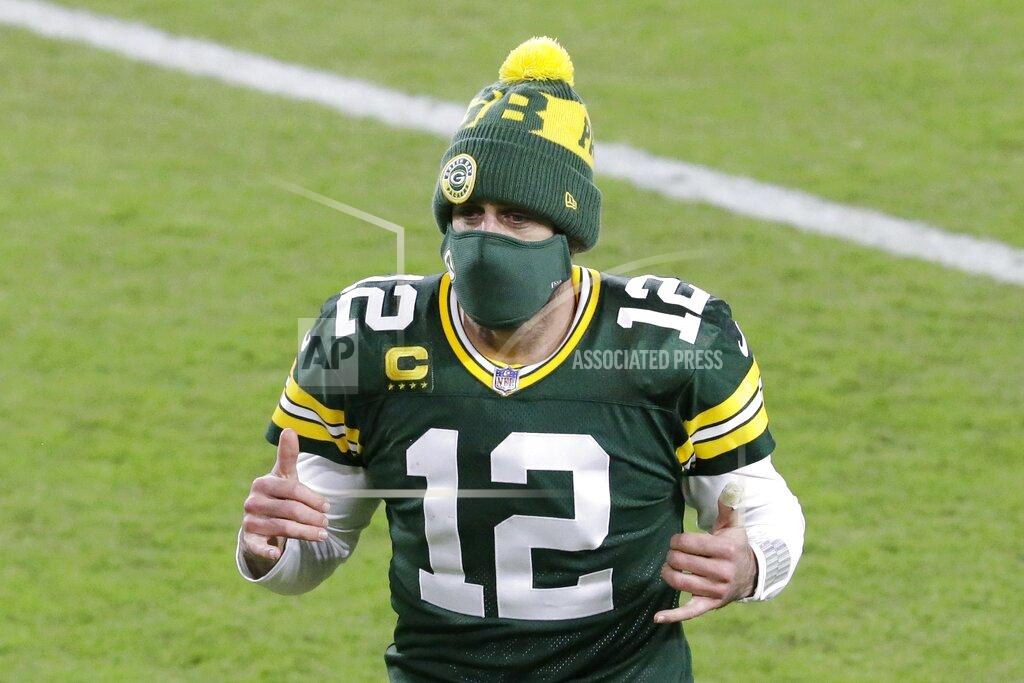 Green Bay Packers' Aaron Rodgers reacts as he runs off the field after an NFL football game against the Chicago Bears Sunday, Nov. 29, 2020, in Green Bay, Wis. The Packers won 41-25. (AP Photo/Mike Roemer)