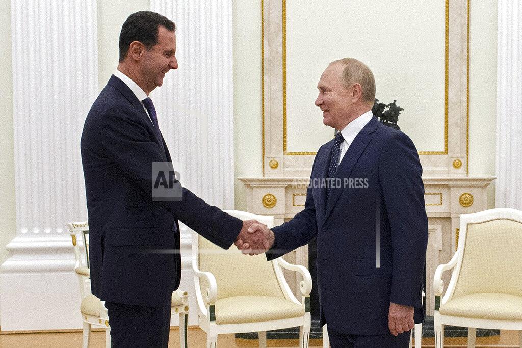 Mikhail Klimentyev Russian President Vladimir Putin, right, greets Syrian President Bashar Assad during their meeting in the Kremlin in Moscow, Russia, Monday, Sept. 13, 2021. (Mikhail Klimentyev, Sputnik, Kremlin Pool Photo via AP)
