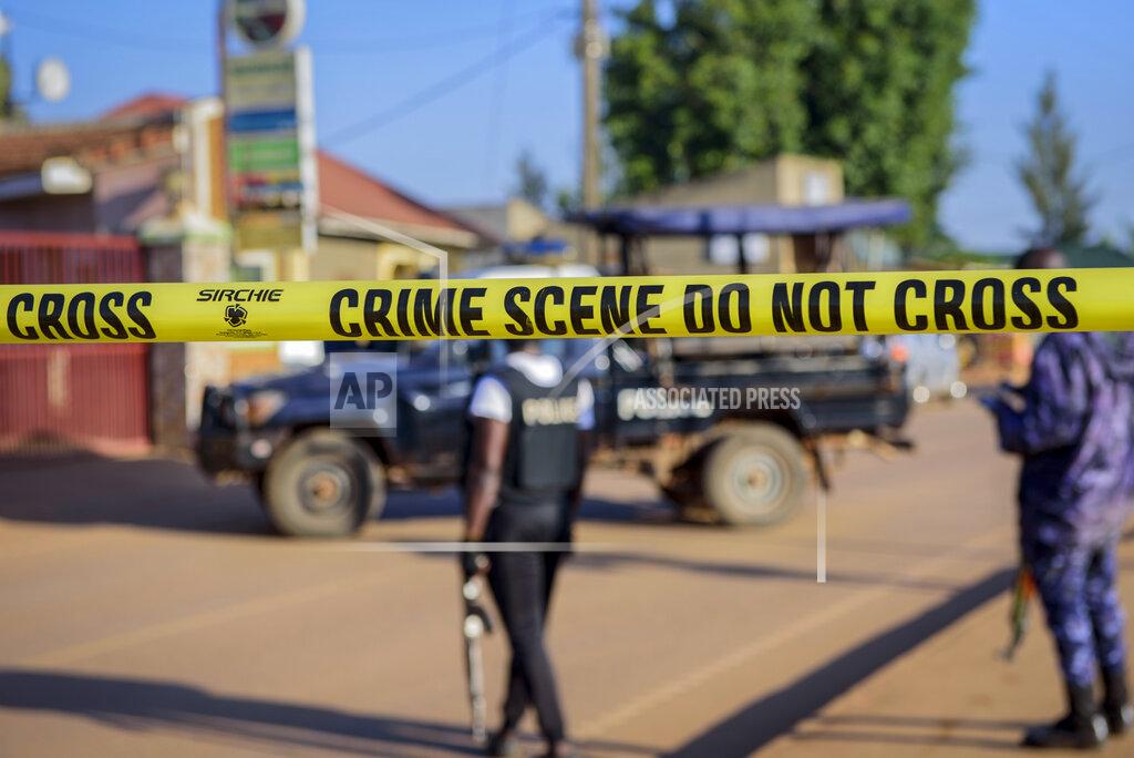 Nicholas Bamulanzeki Police secure a road leading to the scene of an explosion in the Komamboga suburb of the capital Kampala, Uganda Sunday, Oct. 24, 2021. Police said one person was killed and several others injured in the explosion late Saturday and that detectives would "determine whether the explosion arose from an intentional act or not." (AP Photo/Nicholas Bamulanzeki)