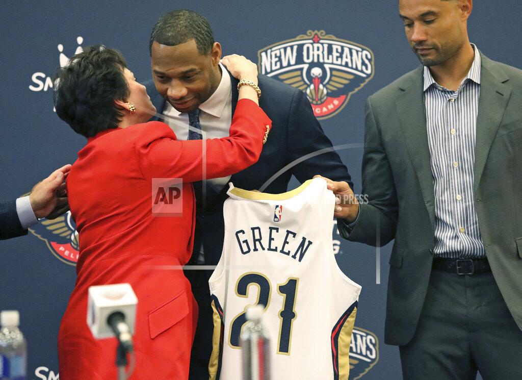 Ted Jackson Willie Green gets a hug from New Orleans Pelicans Governor Gayle Benson after he was introduced as the new head coach for the New Orleans Pelicans NBA basketball team, in Metairie, La., Tuesday, July 27, 2021. At right is Pelicans General Manager Trajan Langdon. (AP Photo/Ted Jackson)