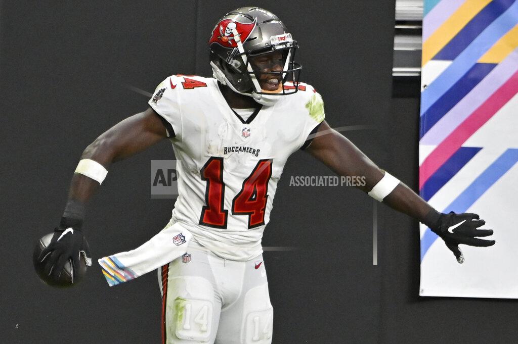 David Becker Tampa Bay Buccaneers wide receiver Chris Godwin (14) celebrates after scoring a touchdown against the Las Vegas Raiders during the second half of an NFL football game, Sunday, Oct. 25, 2020, in Las Vegas. (AP Photo/David Becker)