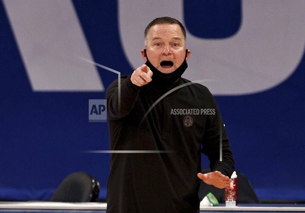 Elsa Denver Nuggets head coach Michael Malone directs his players against the New York Knicks in the fourth quarter of an NBA basketball game Sunday, Jan. 10, 2021, in New York. (Elsa/Pool Photo via AP)